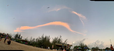 Kite flying in the sky during sunset at Khao Lak, Thailand