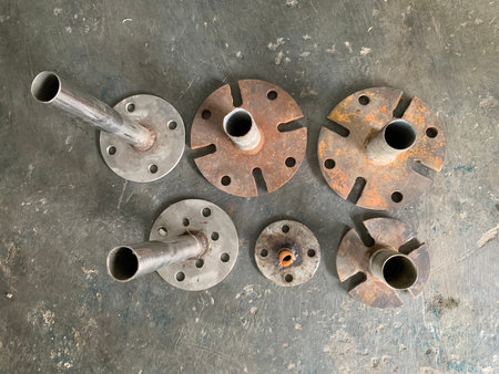 Set of old rusty metal parts for car engine on grunge background