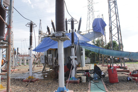 Electricity distribution station with high voltage power lines and transformers.