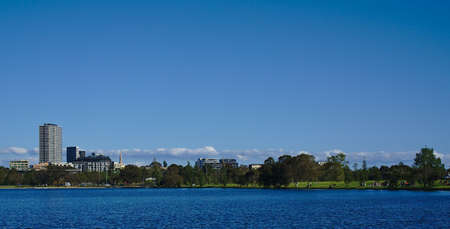 Distant view of Melbourne city from a lakeの写真素材