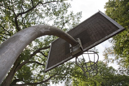 basketball hoop made out of metal with green trees on the backgoundのeditorial素材