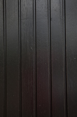 black wood background with straight vertical linesの写真素材