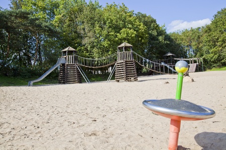 a playground made out of wood and metal in a park in germanyのeditorial素材