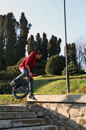 young man making a dangerous jump on a monocycleのeditorial素材