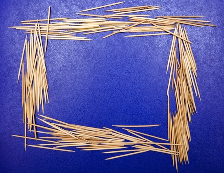 frame made out of toothpicks on a blue backgroundの写真素材