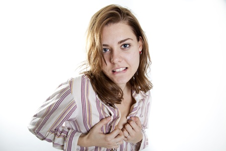 young beautiful girl showing her breasts and biting her lipsの写真素材