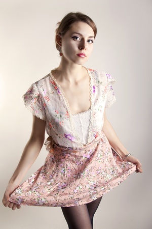 sexy and casul girl holding her dress with stunning eyesの写真素材