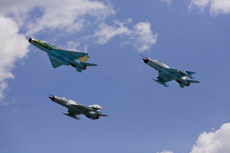 closeup of fighter jet airplanes in formation on a blue skyのeditorial素材