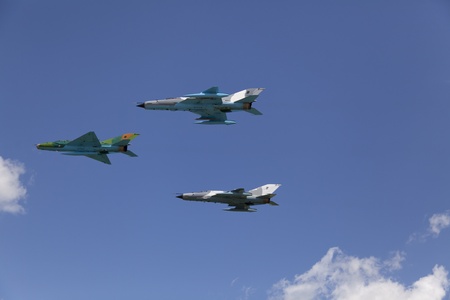 fighter jets on clear blue sky in formationのeditorial素材
