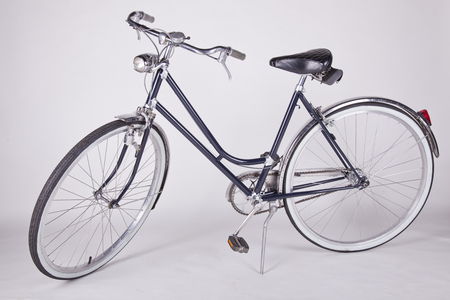 vintage old reconditioned bicycle isolated on whiteの写真素材