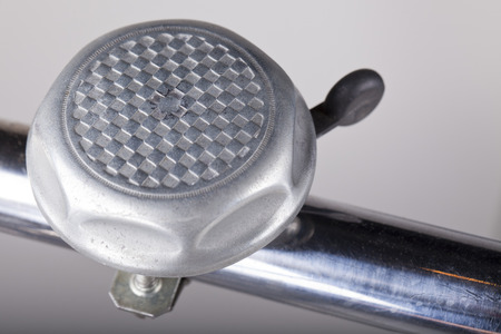 isolated bicycle metal horn on metal rodの写真素材
