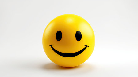 Smiling yellow emoticon on white background.の素材