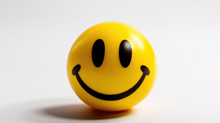 Smiling emoticon on a white background. Yellow smiley.の素材