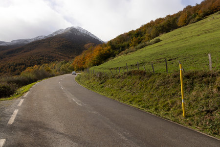 Las ubiÃ±as mountain landscape with vehicle road and snowy peaks during autumn in northern Cantabrian mountains of Spainの写真素材