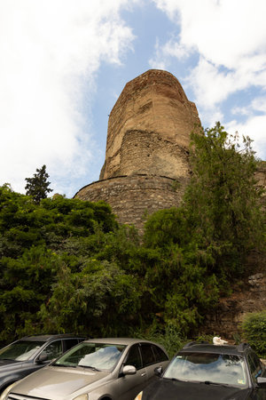 Landscape of waterfall in botanical garden of Tbilisi on a sunny summer day