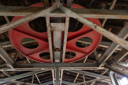 Detailed closeup of metal turning wheel in abandoned  coal mining factory.の写真素材