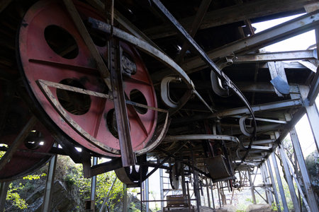 Detailed closeup of metal turning wheel in abandoned  coal mining factory.の写真素材