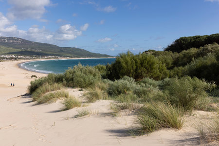 Ocean landscape with sea and beach in Punta Paloma in Spain on a bright sunny day with clouds.の写真素材