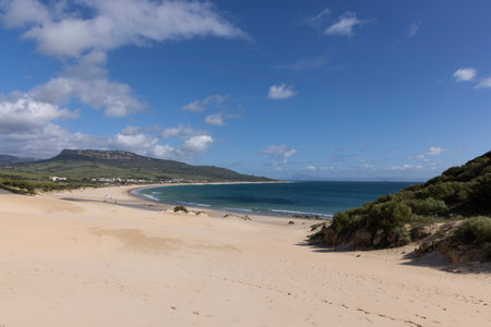 Ocean landscape with sea and beach in Punta Paloma in Spain on a bright sunny day with clouds.の写真素材