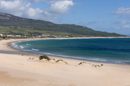 Ocean landscape with sea and beach in Punta Paloma in Spain on a bright sunny day with clouds.の写真素材