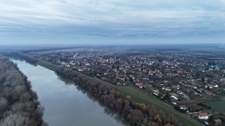 Aerial view showing tiszasuly village on the bank of a river in jasz nagykun szolnok
