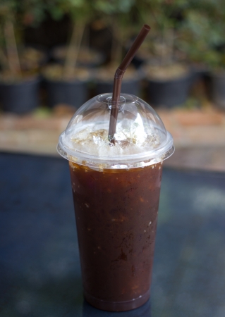 Ice black coffee on tableの写真素材