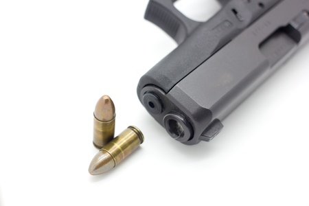 Gun with ammunition on white background