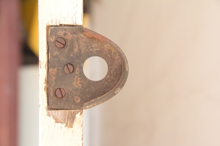 Metal nut rusted on the door 