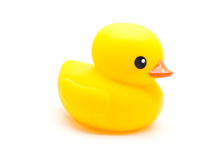 yellow rubber duck isolated on whiteの写真素材