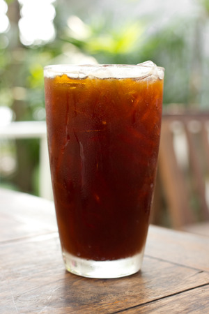 Delicious ice coffee americano on wood table.の写真素材