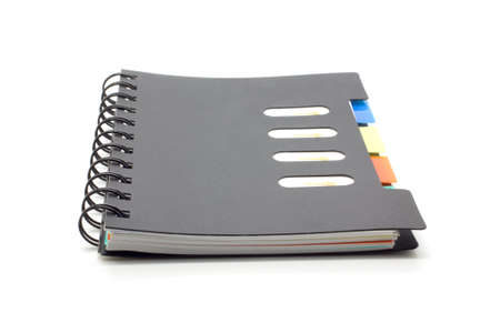 Black notebook isolated on white backgroundの写真素材