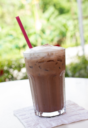 Ice chocolate drink in decorated tall glassの写真素材