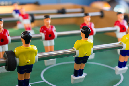 Soccer table game with yellow and red playersの写真素材