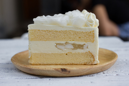 a piece of coconut cake on dish.の写真素材