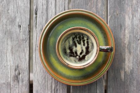 Top view of hot coffee on the wooden table.の写真素材
