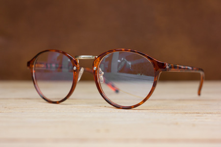 eyeglasses ,  on wood background.の写真素材