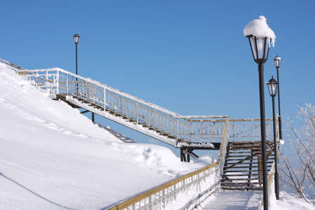 a stair is in winter on a background dark blue skyの写真素材