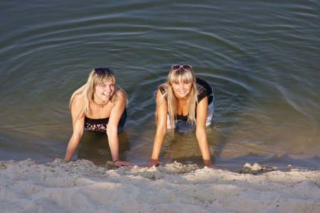 two beautiful women in waterの写真素材