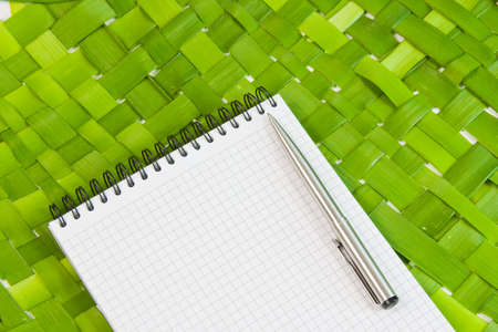 beautiful designer background  with a notebook and penの写真素材