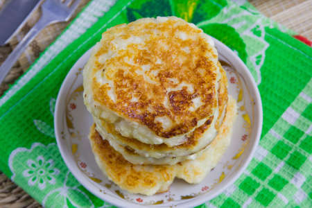 fried curd pancakes on a dishの写真素材