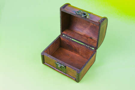 decorative open small box on a light green background