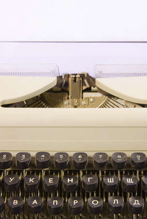 old typewriter and clean sheet of paper