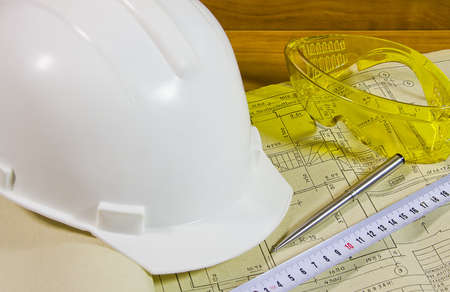 protective facilities helmet and glasses on project documentationの写真素材