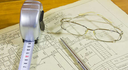roulette, pen and glasses on project documentation