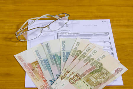 business still life with a receipt about the reception of tax return in an electronic kindの写真素材