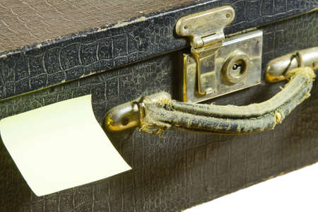 fragment of ancient black suitcase and sticky papers