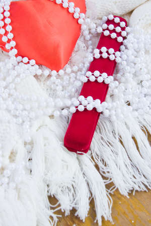 red heart, gift case and beads from pearlsの写真素材