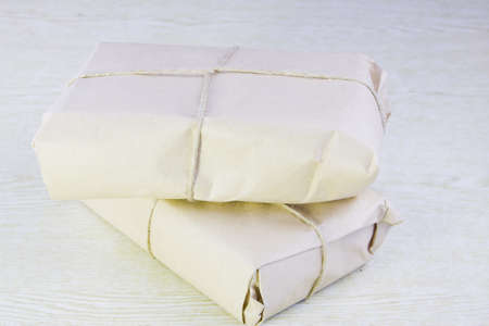 two parcels bandaged by a ropeの写真素材