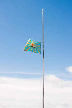 Raising of a flag of aircraft on a background of the blue skyのeditorial素材