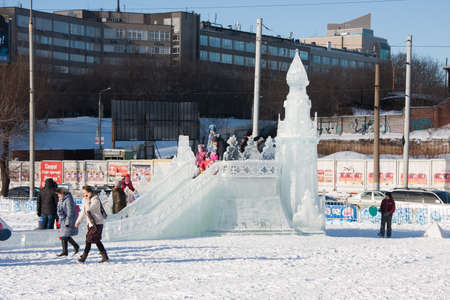 PERM, Russia, February, 06.2016: adults with children in an icy town on the Esplanade,  Lenina Streetのeditorial素材
